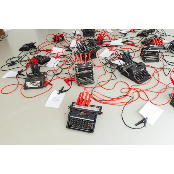 mounir fatmi<br>Inside The Fire Circle 02, 2021, 17 Typewriters, starter cables, paper, 300 x 300 cm